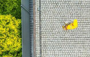 Construction Worker Finishing Driveway Paving photo