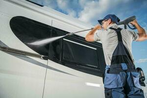 Car Detailer Pressure Washing Modern Camper Van photo