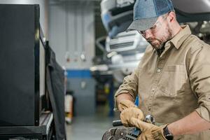 Mechanic Carrying His Tools photo