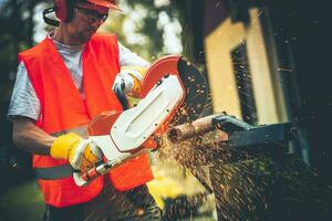 Men Using Metal Cutter photo