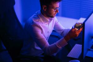 Businessman Working Late in His Office photo