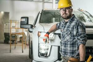Construction Contractor in Front of His Pickup Truck photo