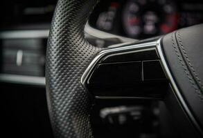 Modern Car Steering Wheel Close Up photo