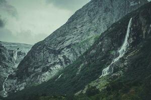 Dramatic Norwegian Landscape with Waterfall photo