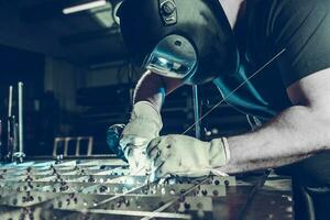 Professional Welder Performing TIG Welding photo