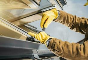 Modern Wooden Roof Window Installation Performed by Professional Worker photo