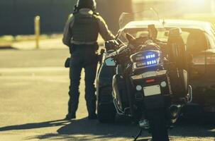 Motorcycle Police Officer Giving Traffic Ticket photo