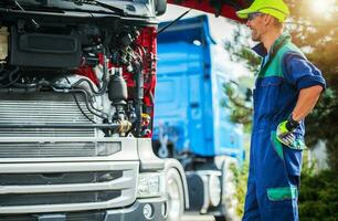 Happy Smiling Professional Truck Mechanic photo