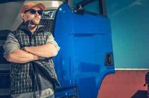 Trucker In Front of Truck photo