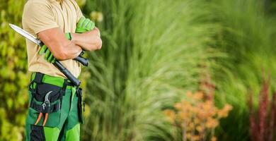 Professional Gardener with Garden Scissors photo