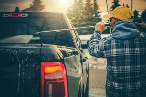 Men Power Washing His Pickup Truck photo