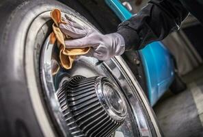 Men Cleaning Car Wheels photo