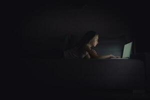 Girl Browsing the Internet at Night photo