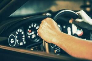 Men Driving His Exotic Car at Night Close Up photo