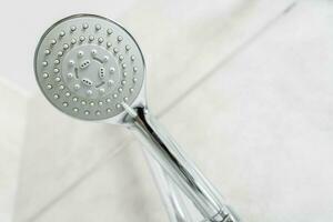 Close Up Of Silver And White Shower Head. photo
