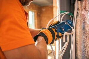 Electrician Preparing Electric Outlet photo