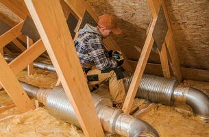 Heating and Cooling Technician Installing System Elements photo