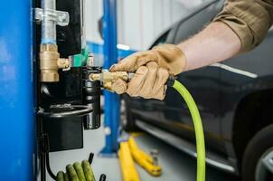 Tire Air Compressor at Car Service Station photo