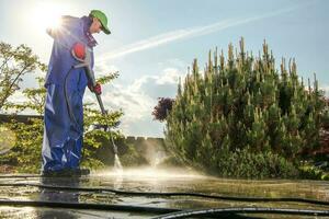 Men Washing Garden Paths photo