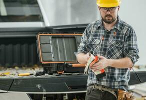 Construction Worker Preparing Himself For a Job photo