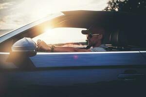 Men in His 40s Enjoying Drive in His Convertible Car photo