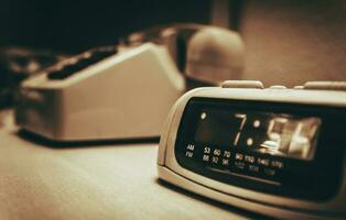 Vintage Hotel Room alarm Clock and the Analog Phone photo