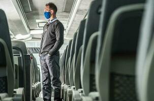 Coach Bus Driver Wearing Face Mask Confused by Economy Situation photo