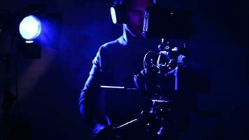 Modern Digital Camera and Filmmaking Industry Operator in Misty Room video