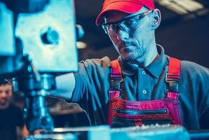 CNC Milling Machine Operator During Work photo