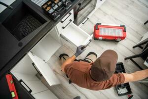 Cabinetmaker Specialist Finishing New Kitchen Cabinets photo