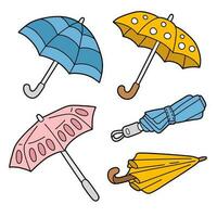 conjunto de dibujos animados paraguas vector
