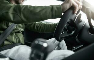 Caucasian Men Behind the Car Wheel photo