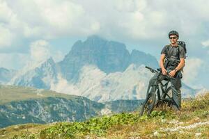 Satisfied Cyclist on the Top of the Hill photo