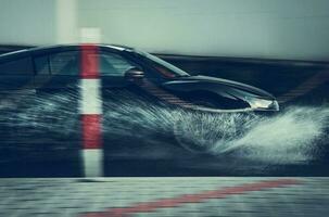 Modern Performance Car Speeding Through the Water photo