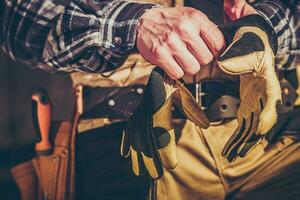 Construction Worker Wearing Hands Safety Gloves photo