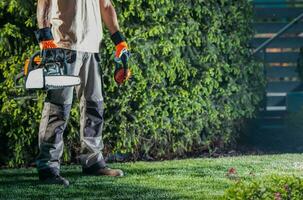 Men with Gasoline Saw photo