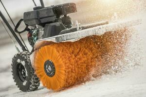 Snow Removal with Brush Broom in Action photo