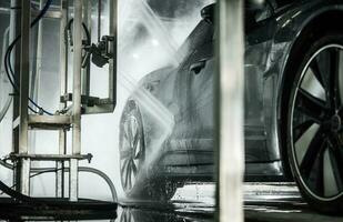 Modern Electric Vehicle Inside High Pressure Touchless Car Wash photo