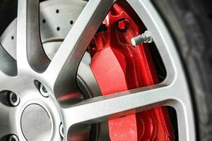Alloy Wheel and Sports Red Brake Caliper photo