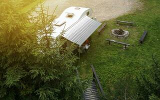 Aerial Photo of Family Camping in Their Modern Camper Van