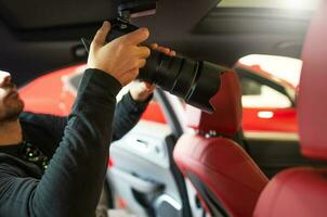 Automotive Professional Photographer with Camera photo