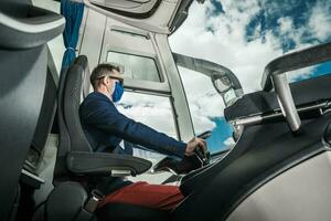 Shuttle Coach Bus Driver Inside the Modern Vehicle photo