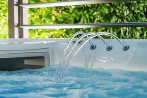 Hot Tub Jacuzzi Fountain and Skimmer Close Up photo
