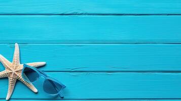 sunglasses and starfish on wooden background. photo