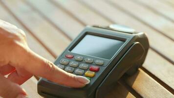 NFC credit card payment. Woman paying with contactless credit card with NFC technology. Wireless money transaction video