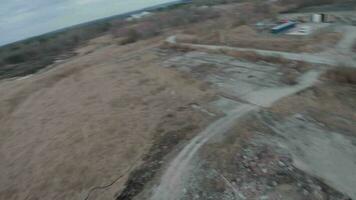 FPV drone flies maneuverable near rusty abandoned walking excavator video