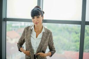 Portrait of a young business smiling woman photo