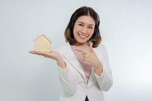 Woman holding home model, Mortgage property insurance dream and real estate concept photo