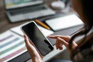 Close up of asian woman hand using a smart phone for mock up display montage. photo