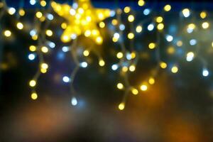 Abstract blurred and bokeh of party light bubs with star LED reflection lighting at night time. photo